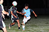 Jose Morastitla of Napoli blasting the ball past a couple of Maidstone Market players
